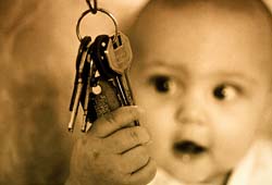 baby holding keys